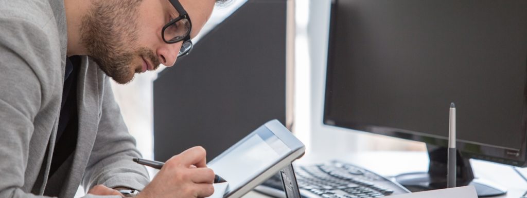 Man working on smart device