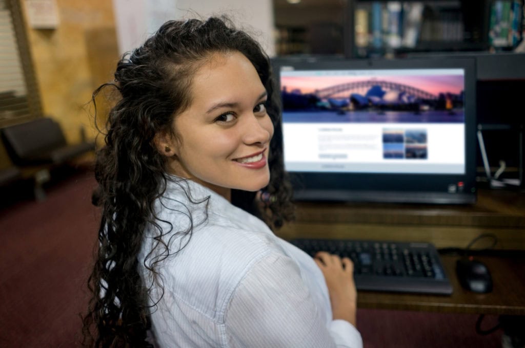 Girllooking at online college