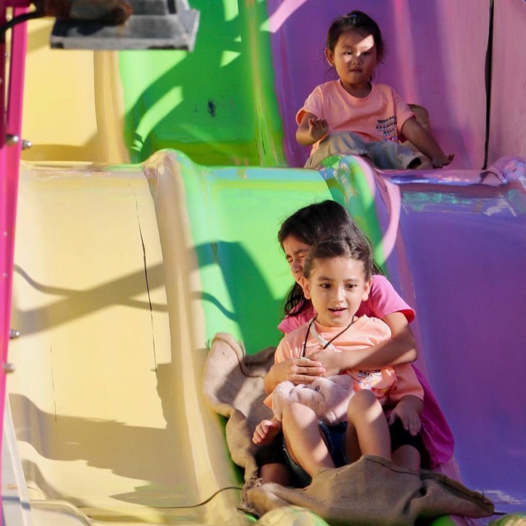 Children are playing on slides