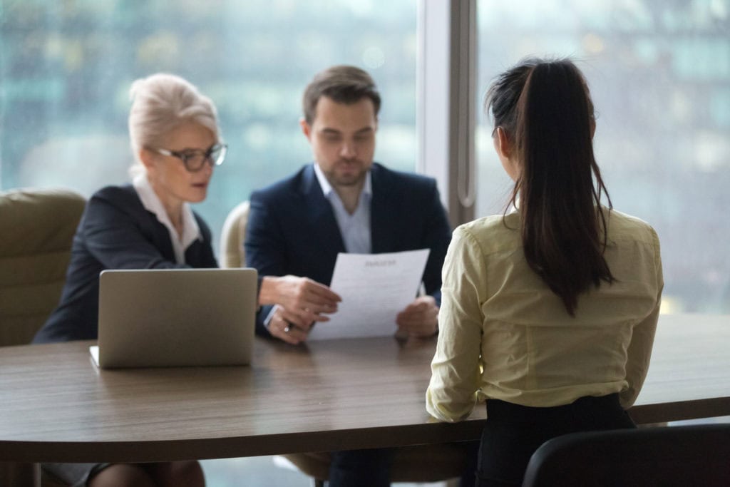 Applicants interviewing table with managers
