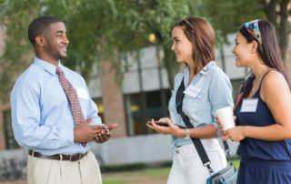 Tour guide with prospective students using interactive campus map