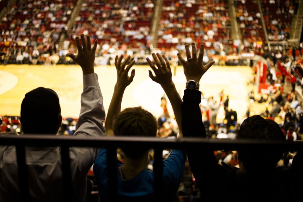 Crowd at basketball game in night