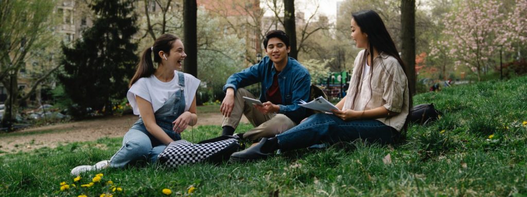 Happier student sitting in the park