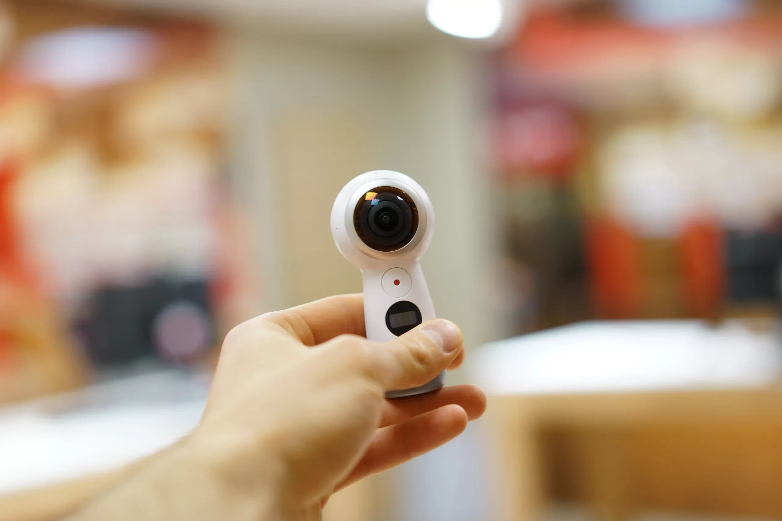 Hand holding 360 camera