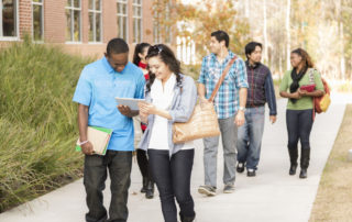 College students easily navigating campus by using a tablet and interactive map built with digital accessibility principles