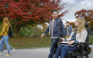 Students going to class across an accessible college campus