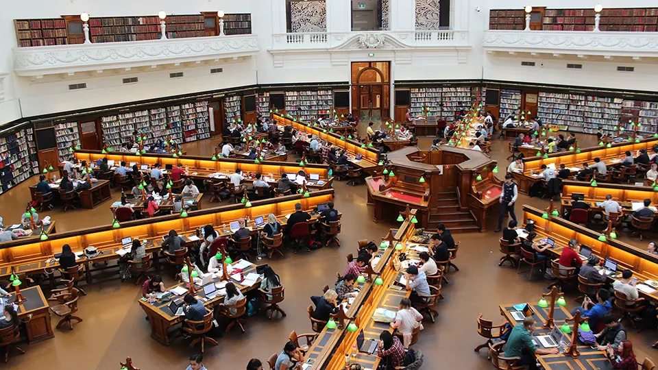 Image of a large group of students at a library.