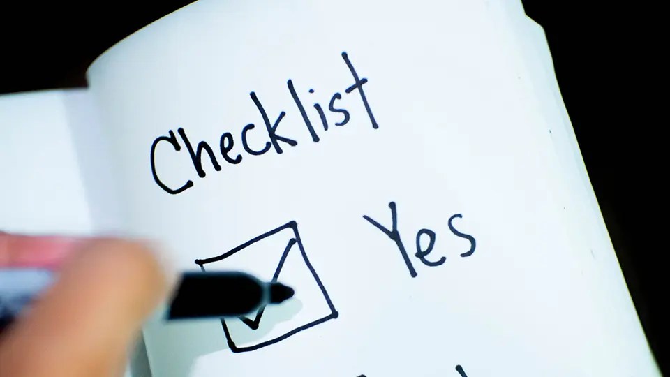 A paper saying "Checklist" with a box checked "yes"
