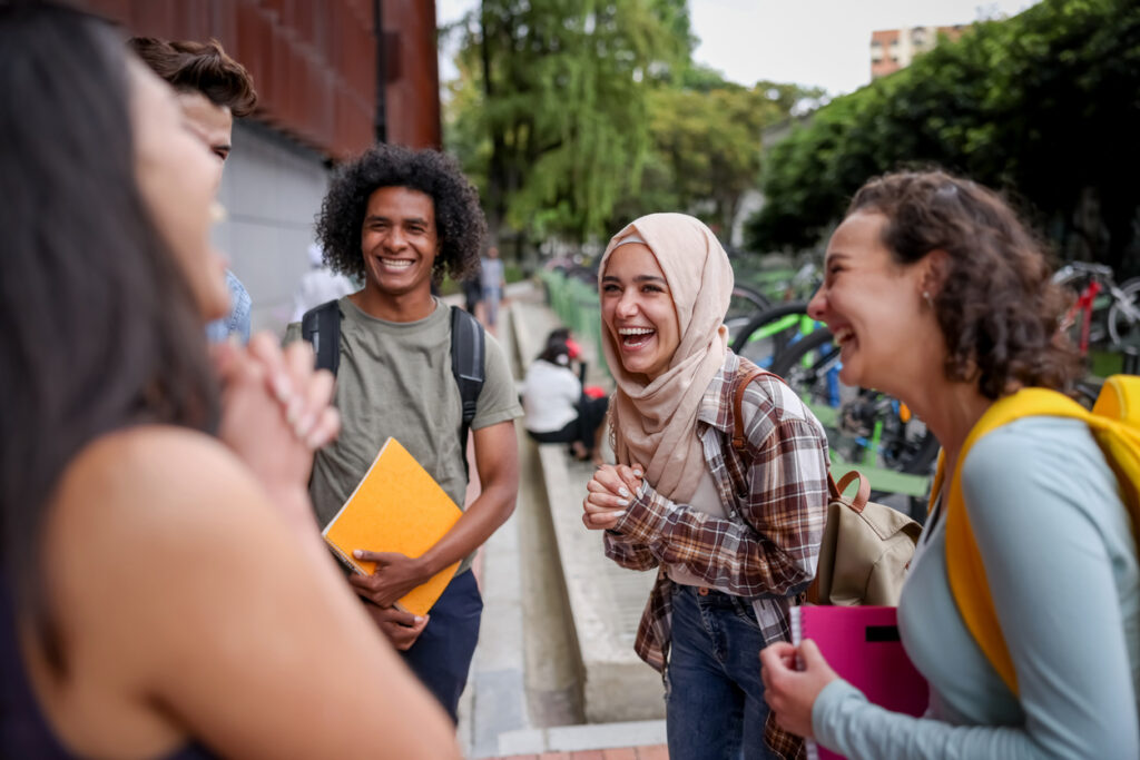 College students laughing and enjoying a sense of community