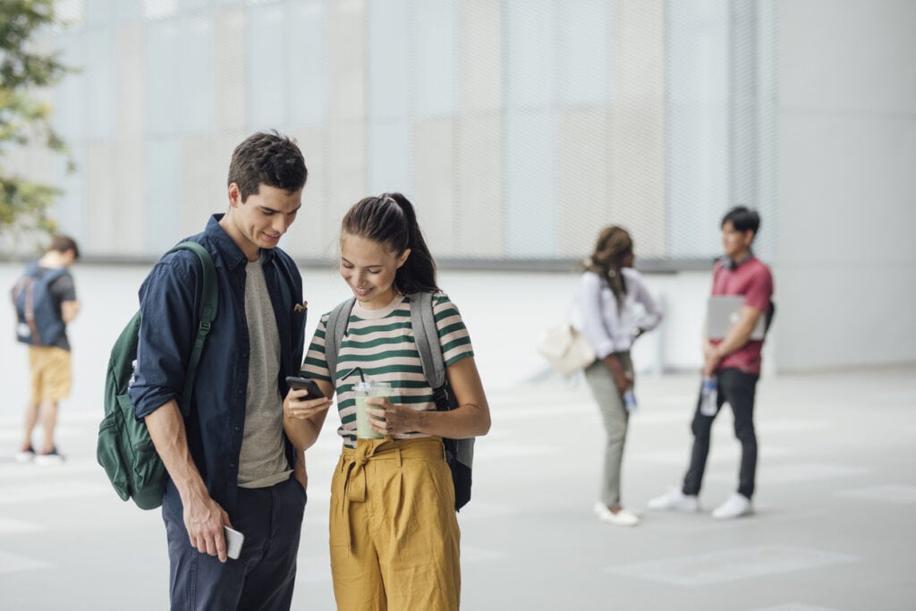 Students looking at ADA-compliant campus maps on a phone