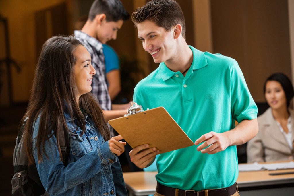 Two college students engaging with college career fair ideas and activities