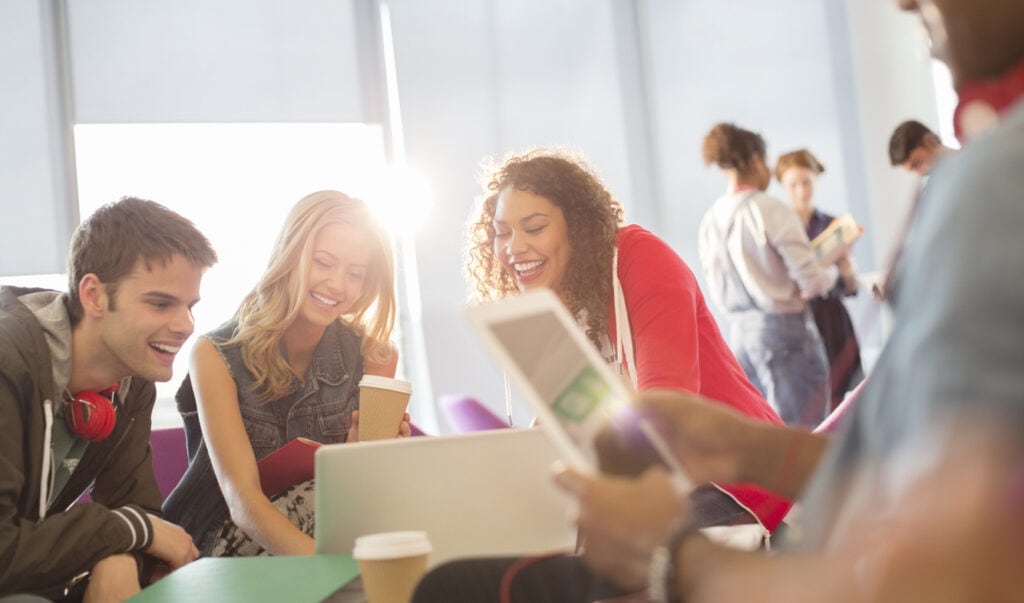 College students creating content for social media for higher education