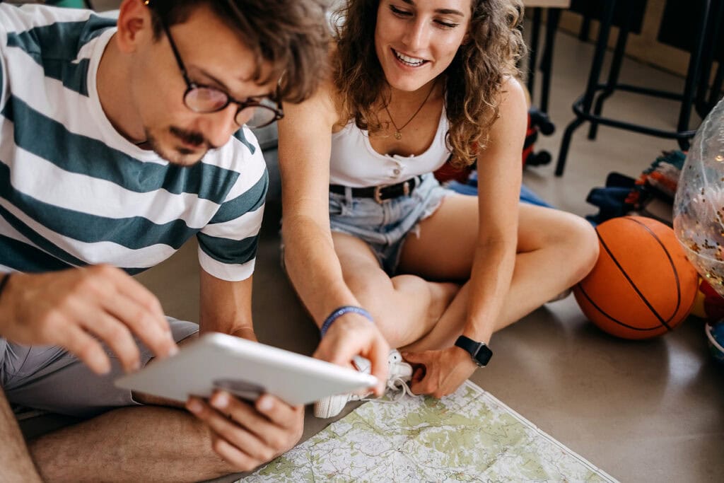 Couple browsing an event calendar as they plan their vacation