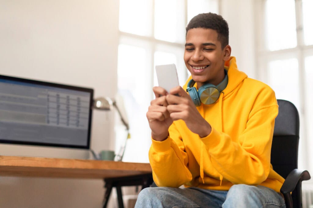 College applicant uploading documents on their phone after getting a text reminder
