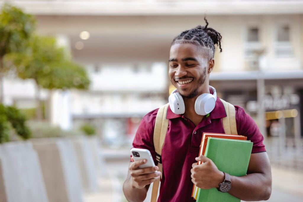 Prospective student enjoying more curated university news after admissions teams learn how to stand out from other universities in digital marketing