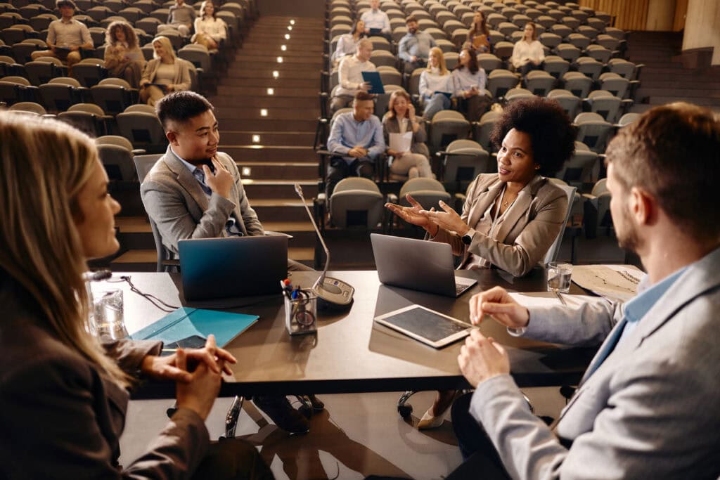 Coworkers discussing how RCM budgeting in higher education will impact the upcoming budget