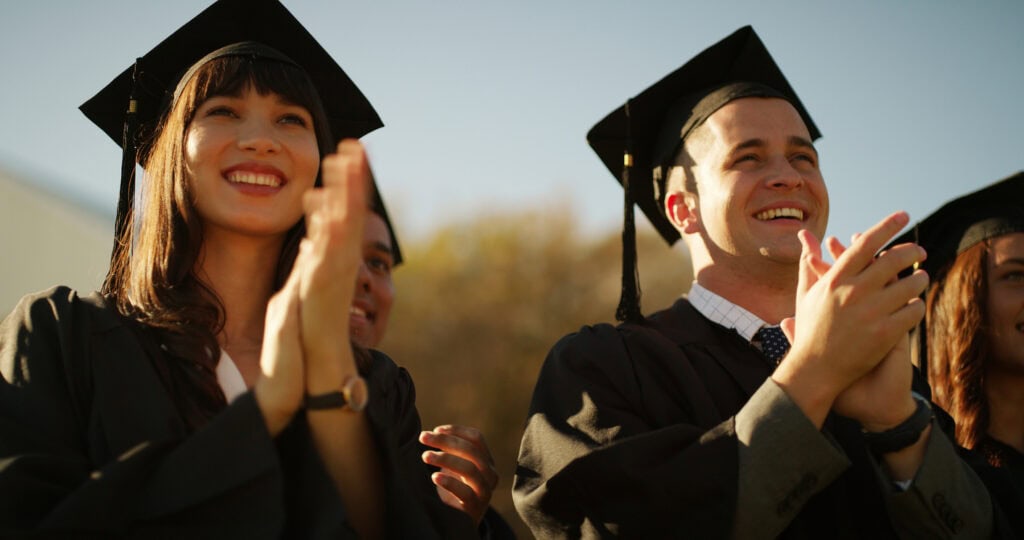 College students applauding at an accessible commencement day celebration