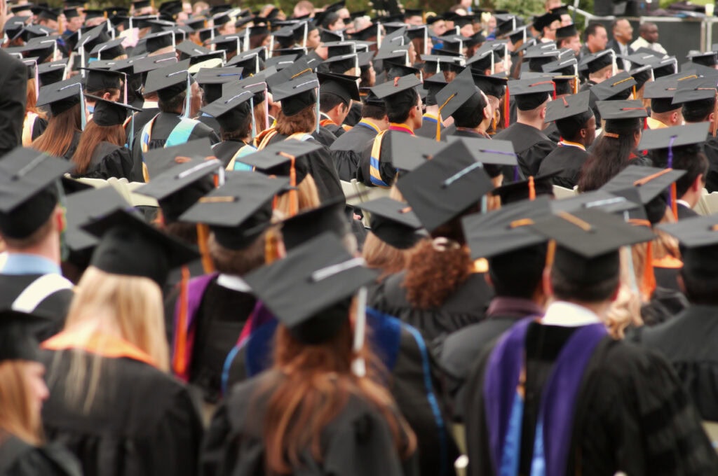 Large crowd of attendees at a successful university commencement