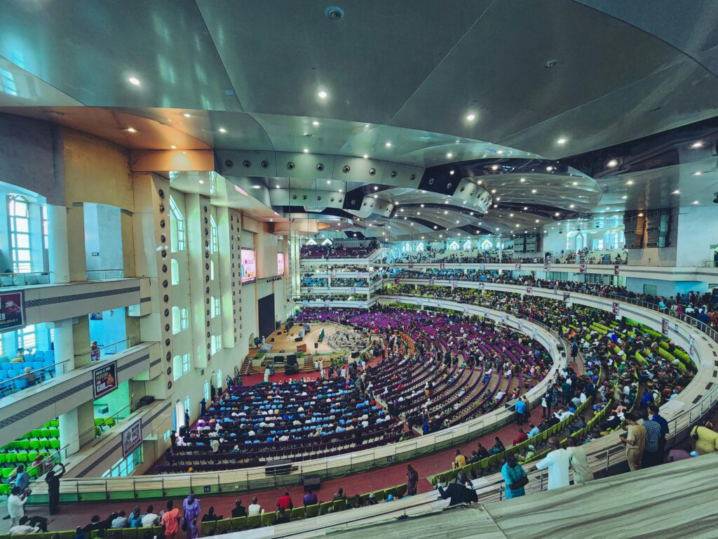 large convention center with people sitting in seats