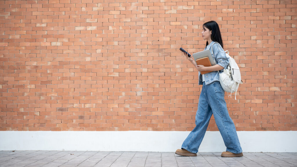 Student navigating campus with a virtual map that prioritizes digital accessibility