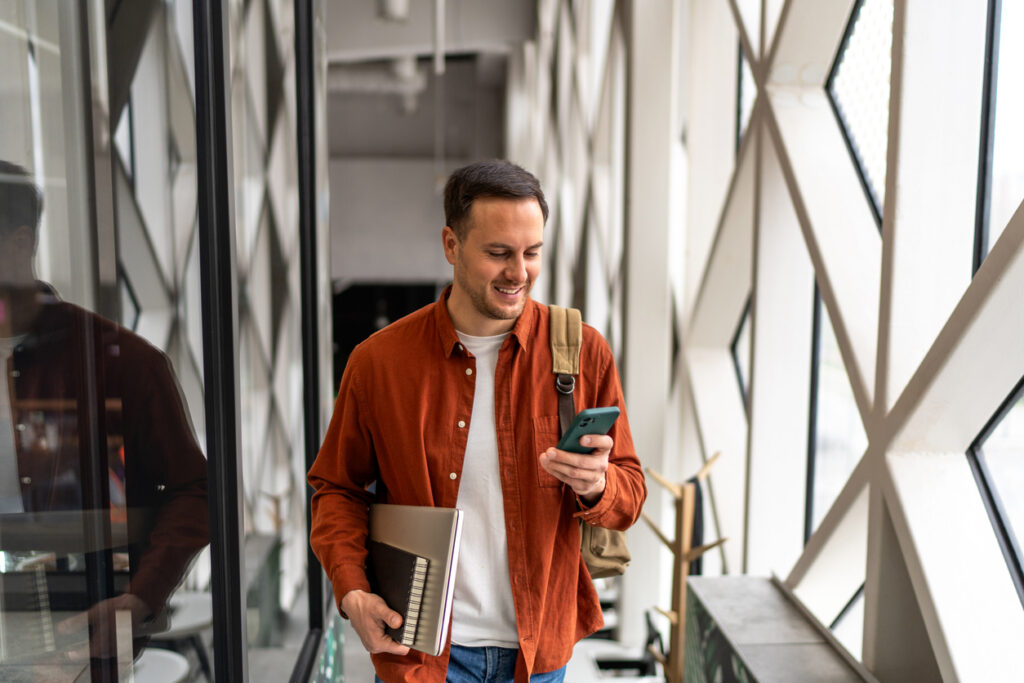 Student using a more comprehensive solution than MappedIn to navigate across an entire university campus
