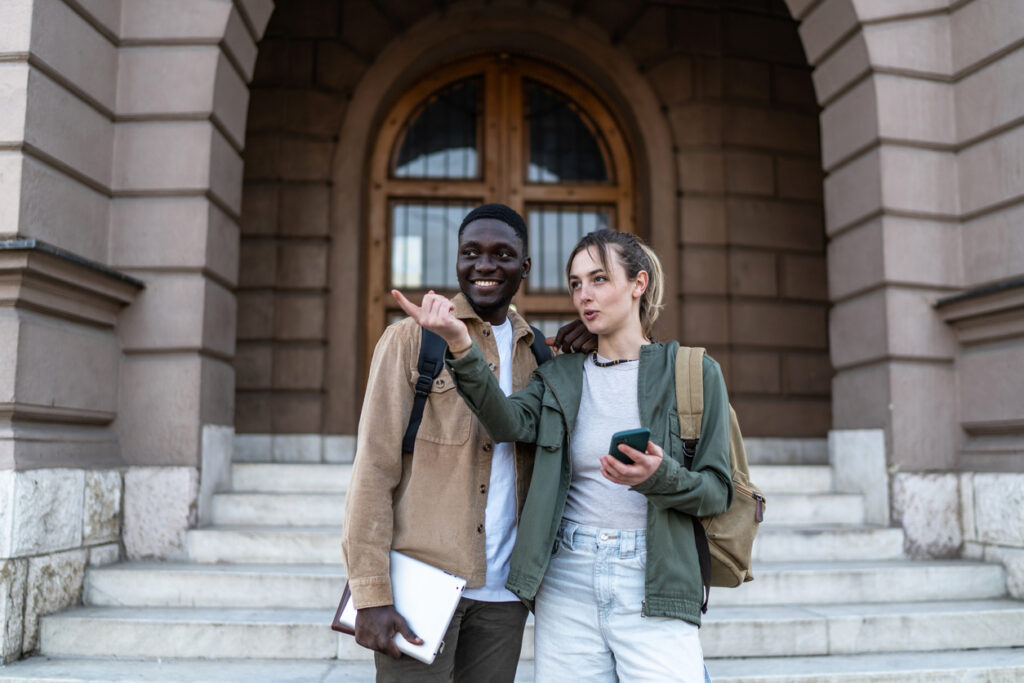 Students using digital tools from their university's campus wayfinding strategy to navigate on move-in day